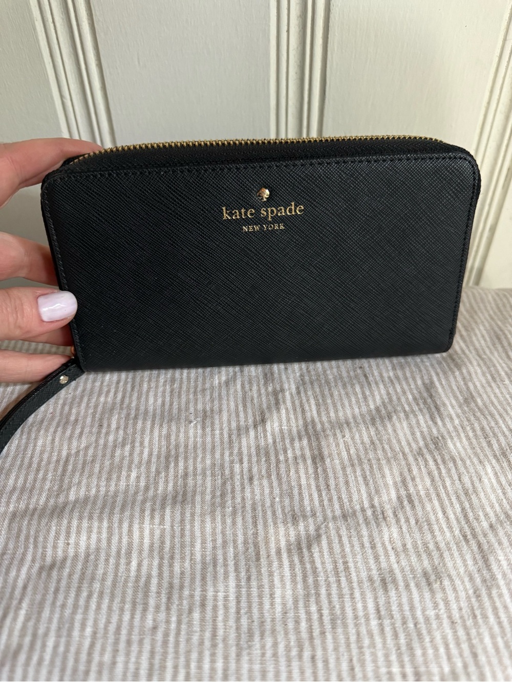 kate spade black zip-around wristlet wallet with gold logo